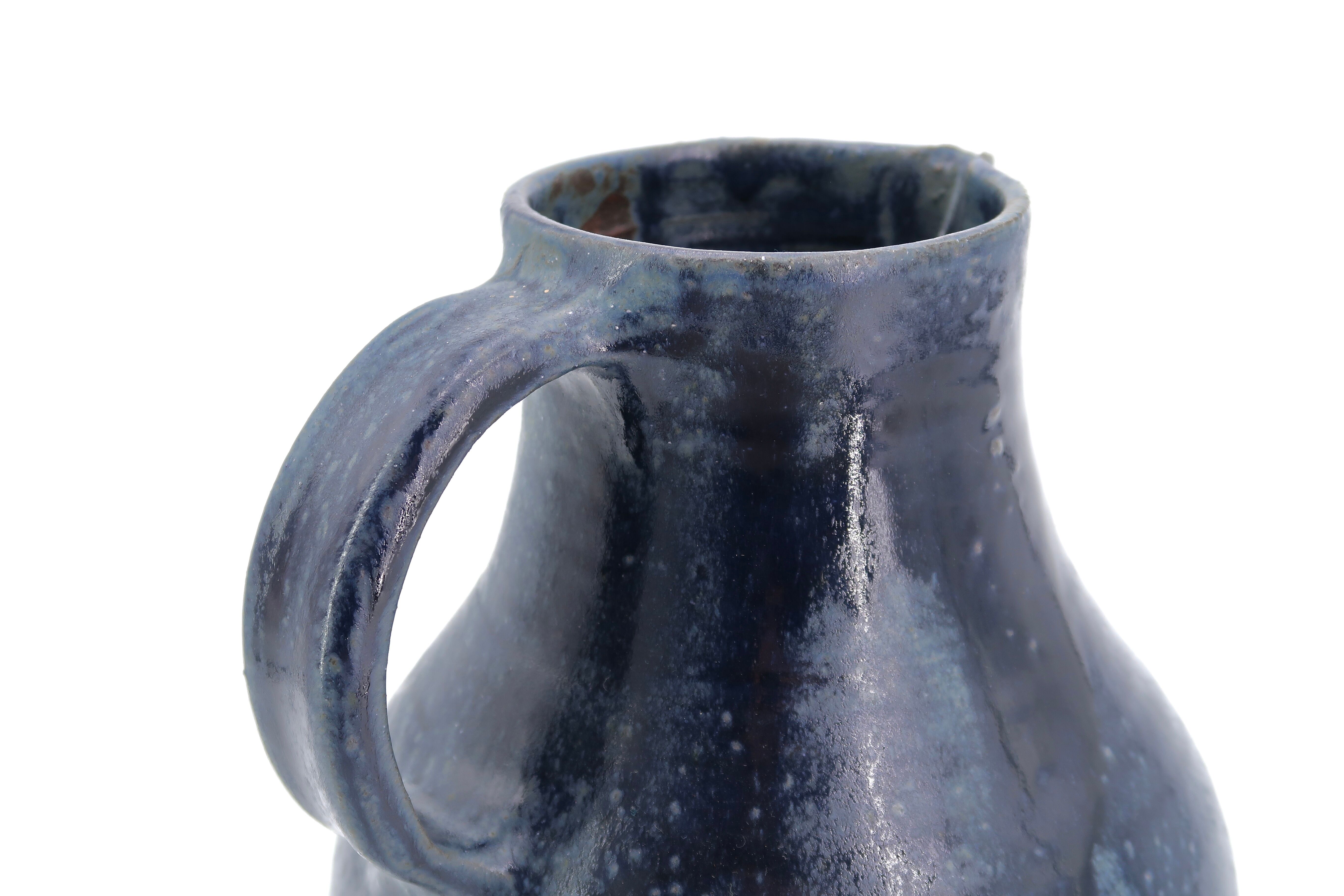 Midnight blue pitcher in sandstone by Jeanne and Norbert Pierlot