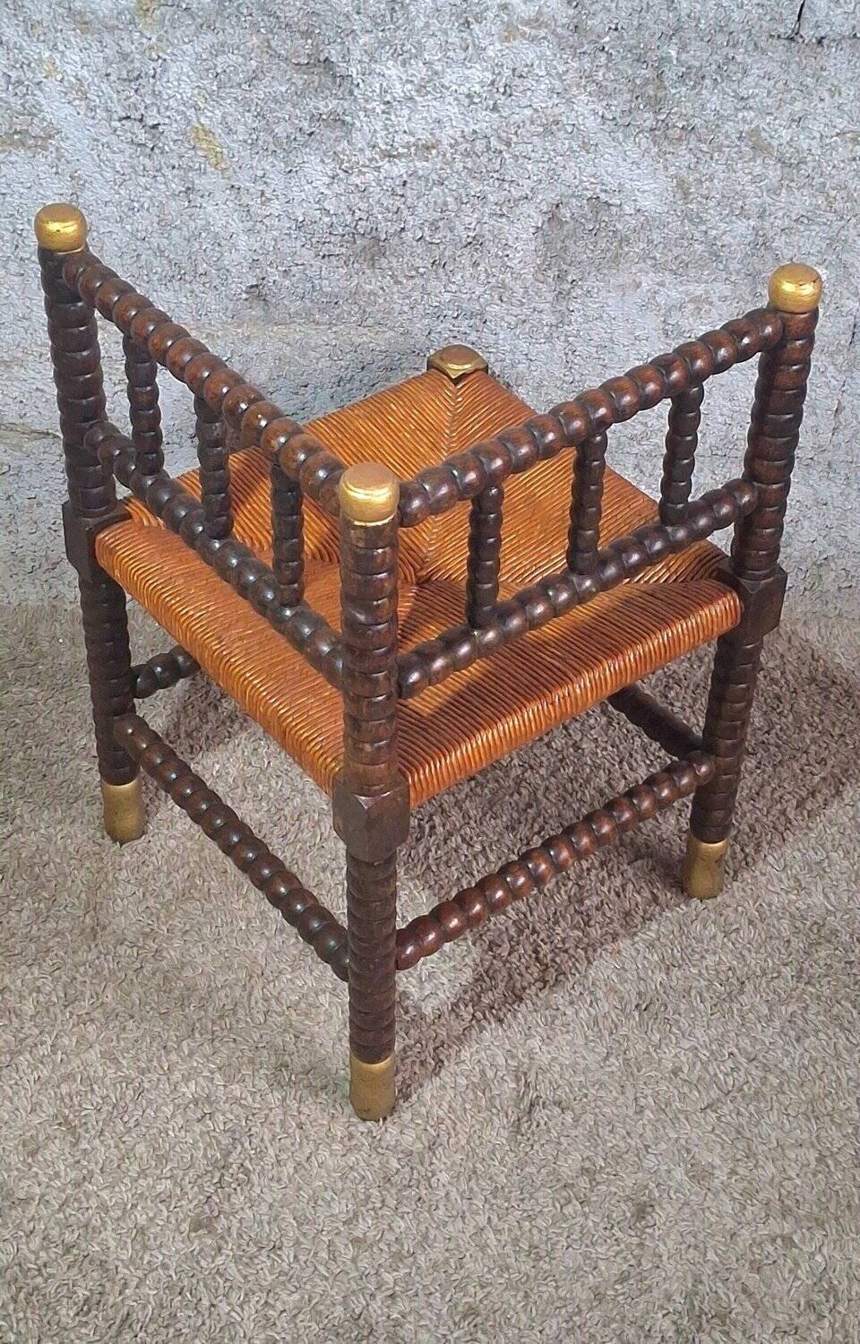 Fireplace corner chair in Louis XIII style, turned wood with braided rush, 19th century.