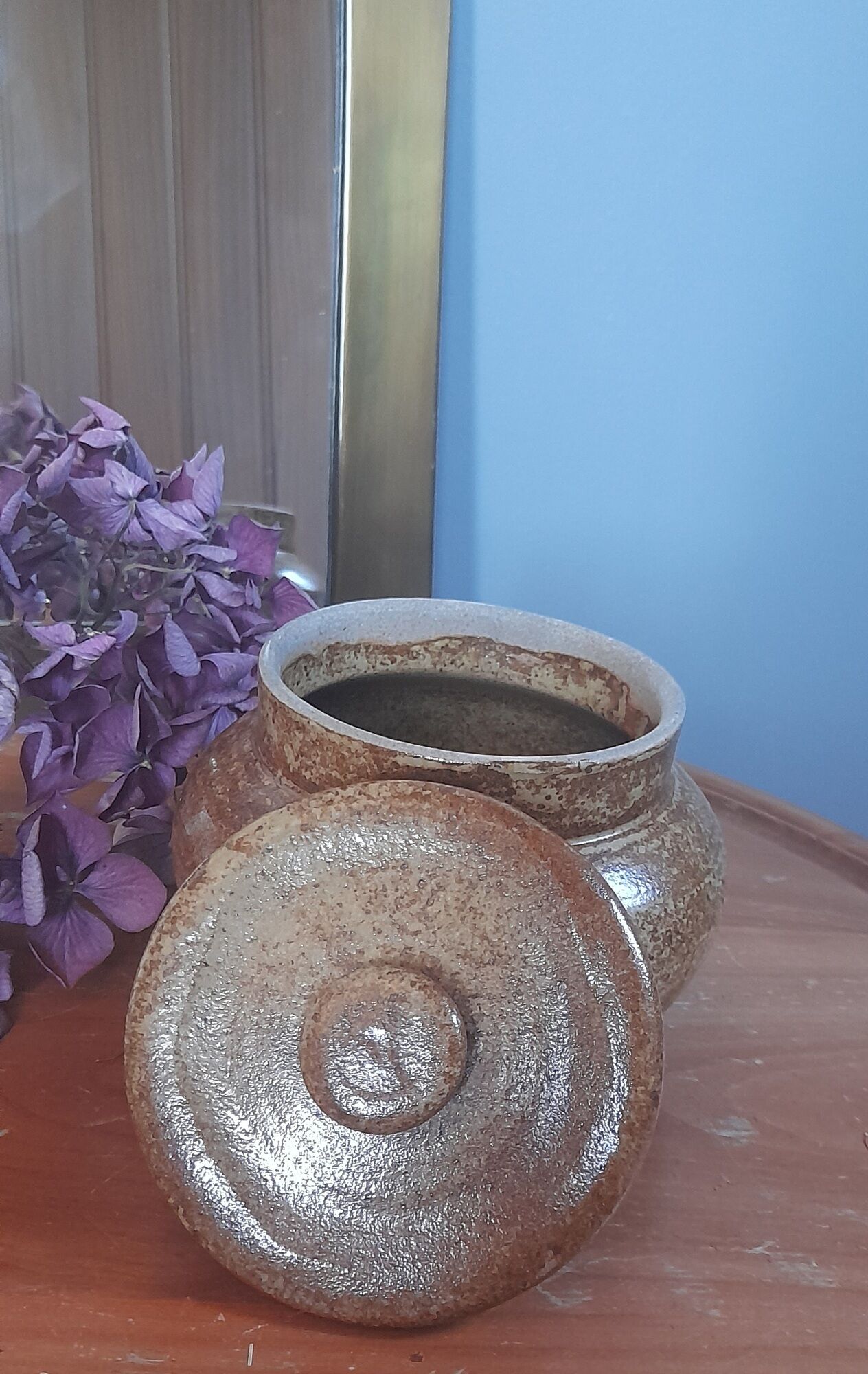 Old salt pot in sandstone, with lid