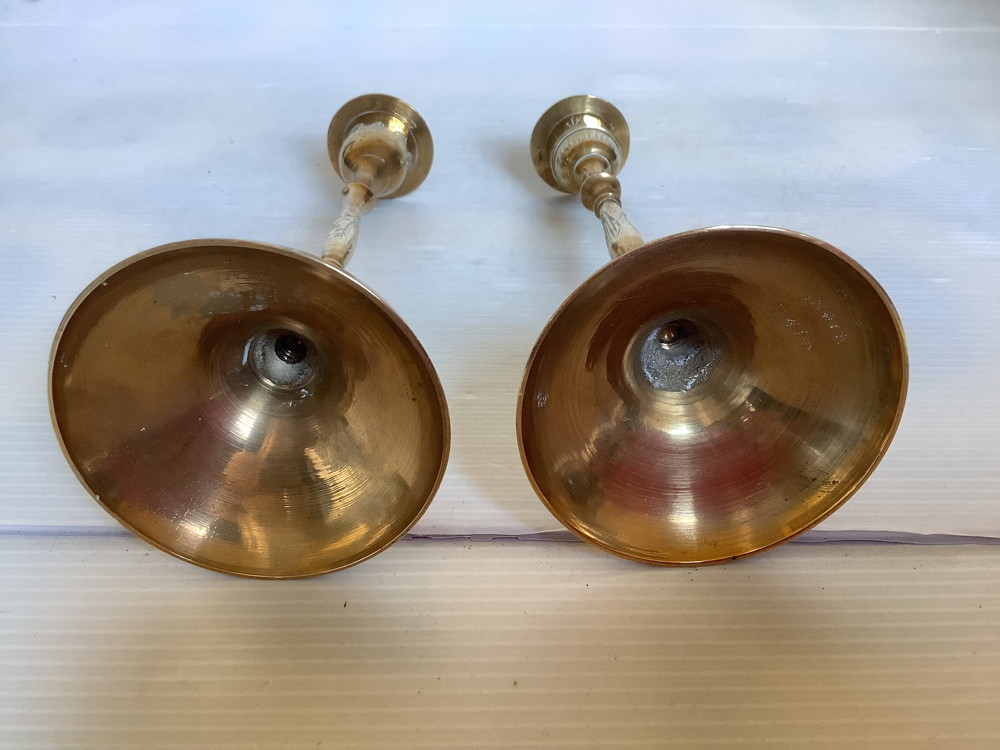 Pair of worked brass candlesticks