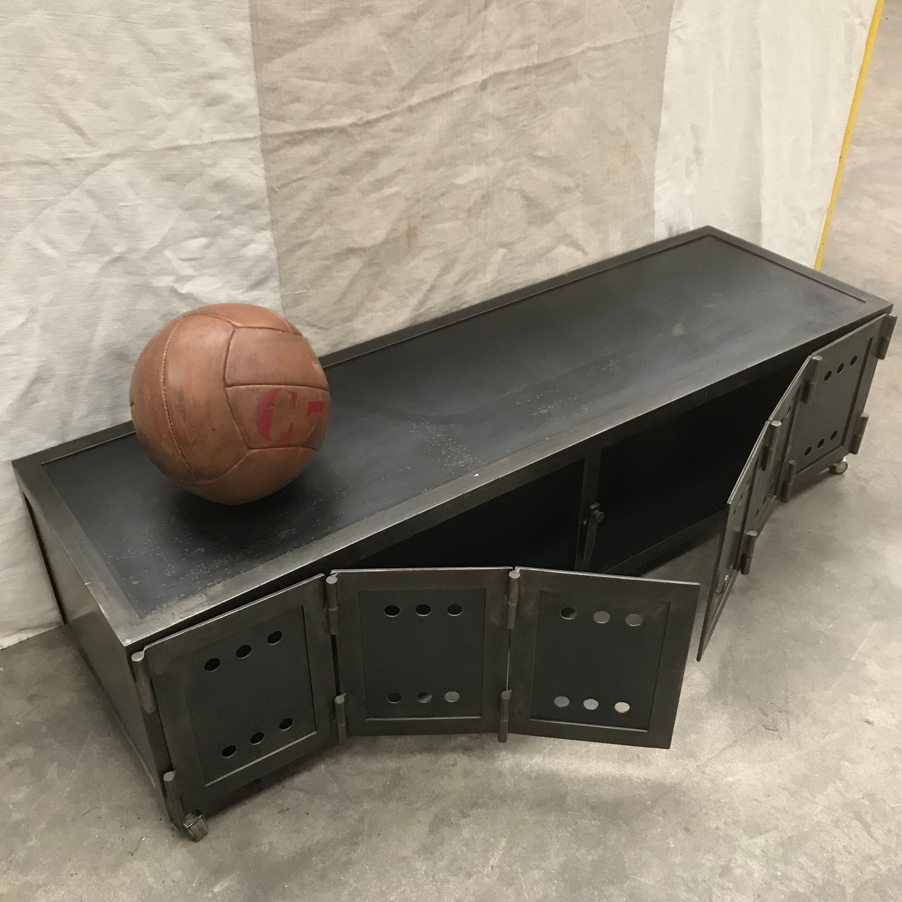 TV stand with natural steel accordion doors