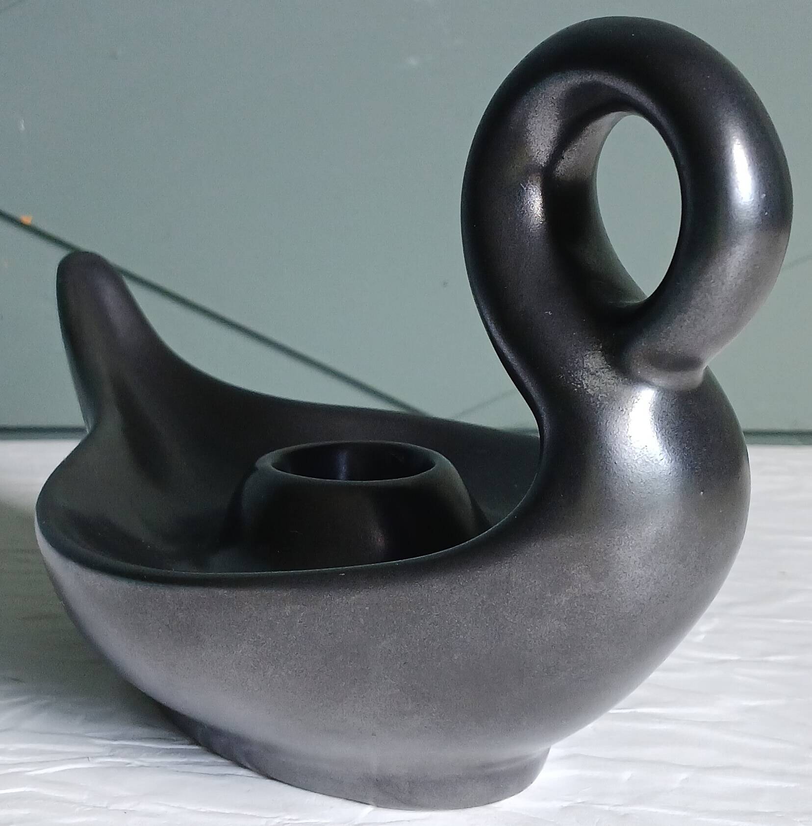 Zoomorphic swan candlestick in black glazed ceramic, Italy circa 1950.