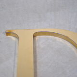Letter sign in gold metal "D" 1980