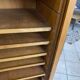 1950s oak office storage cabinet with curtains.