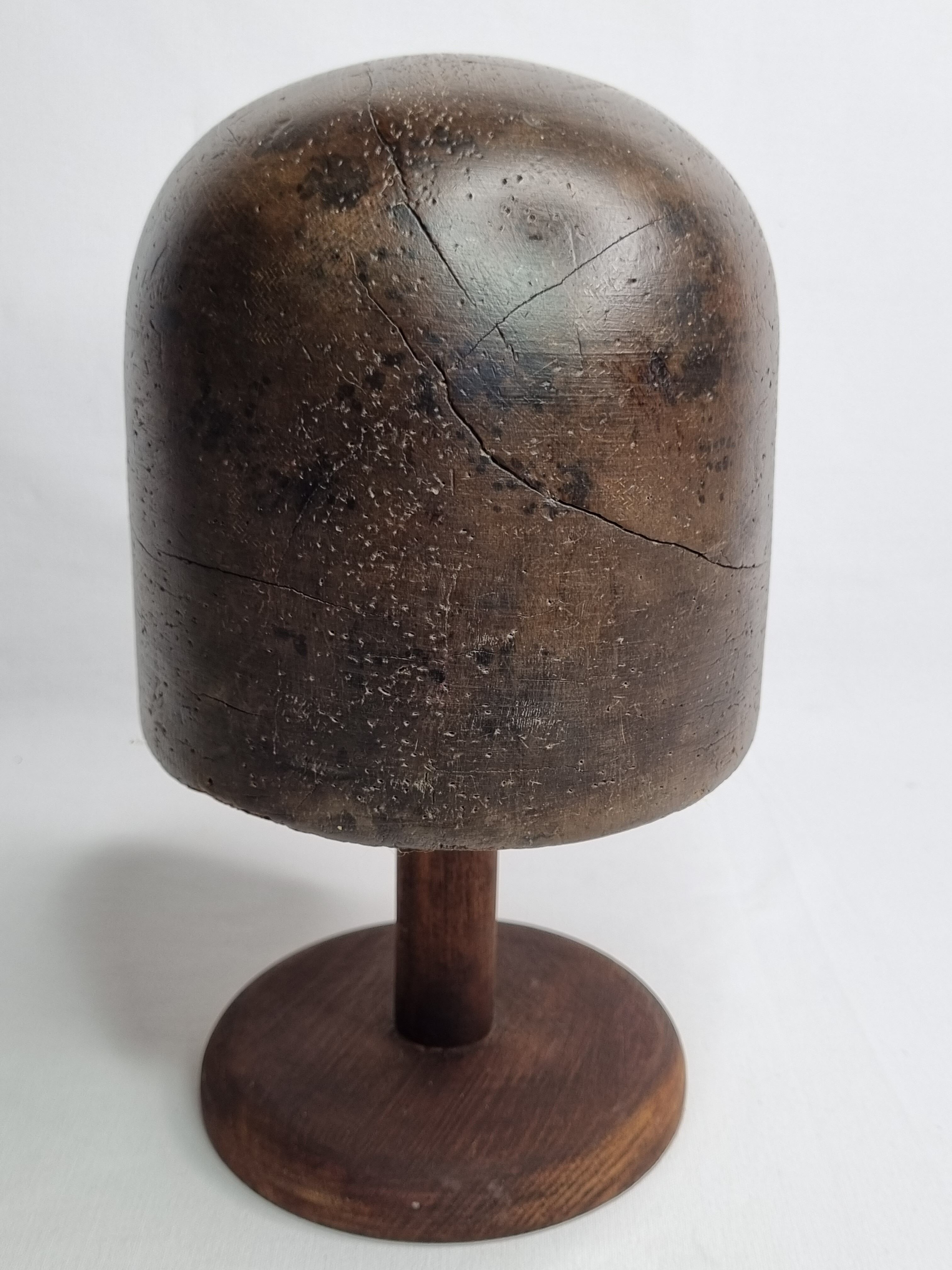 Old solid wood hat shape on foot, 1900