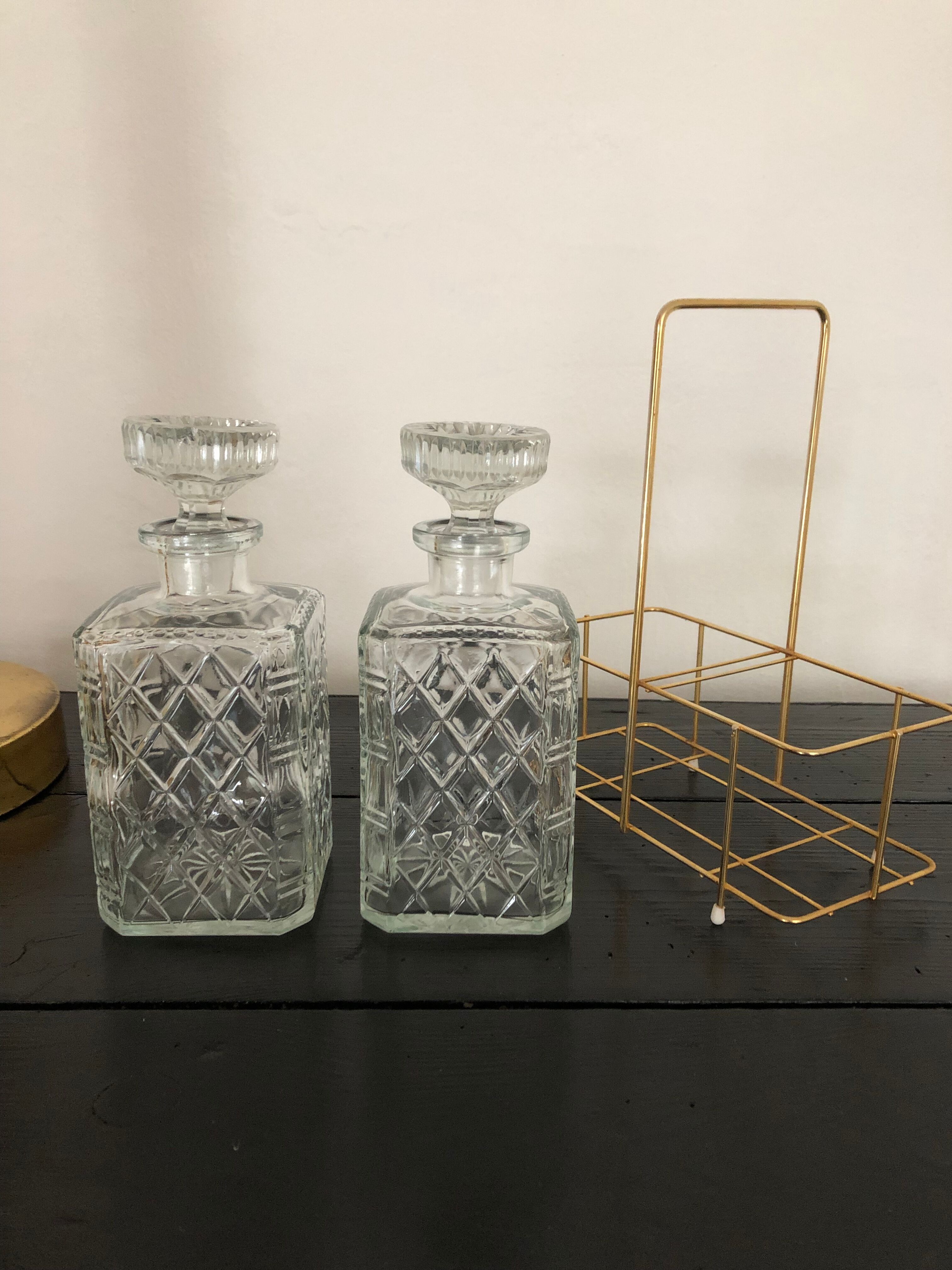 Pair of vintage decanters with brass basket