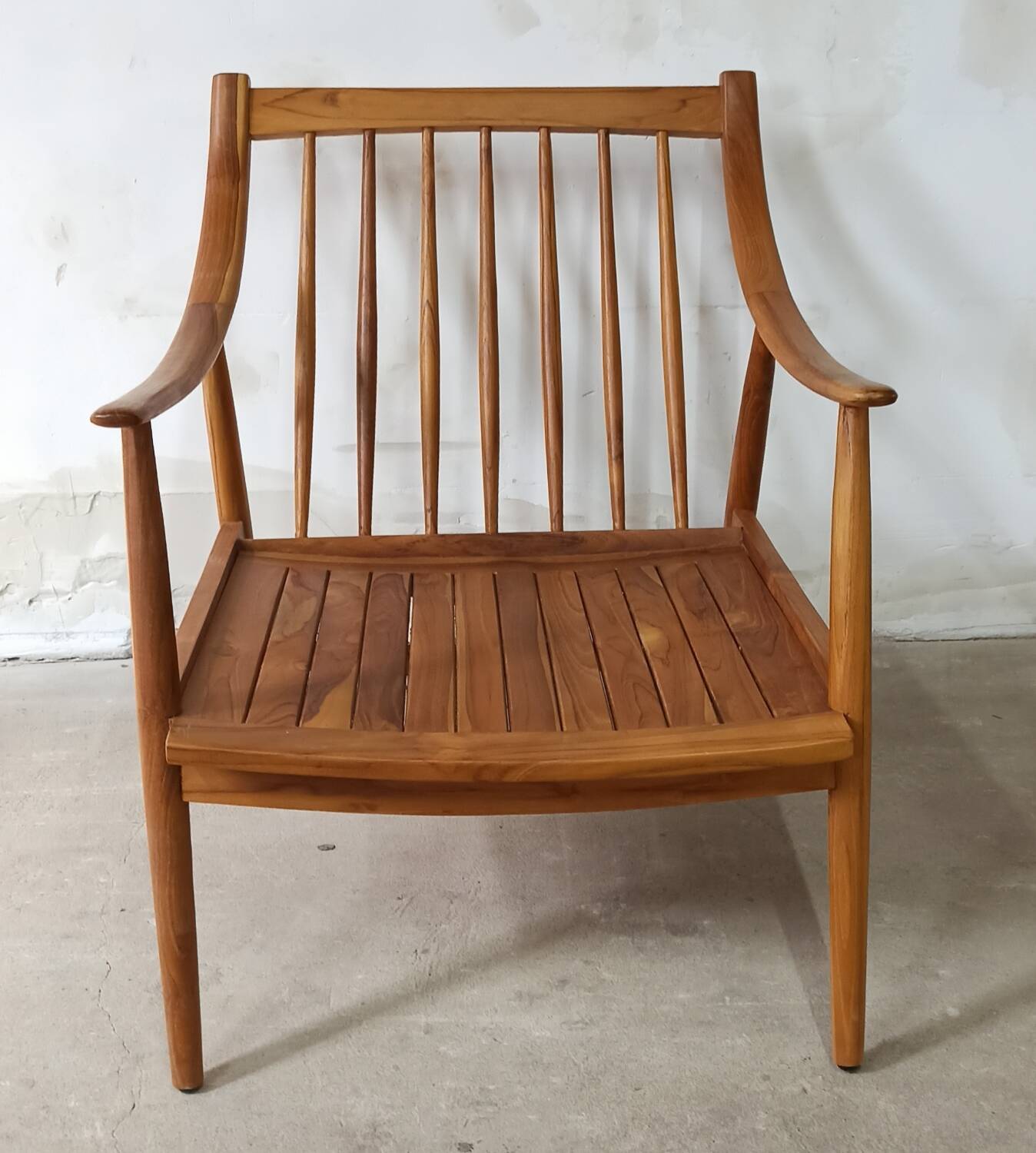 Pair of cozy teak armchairs with cushions