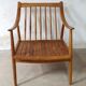 Pair of cozy teak armchairs with cushions