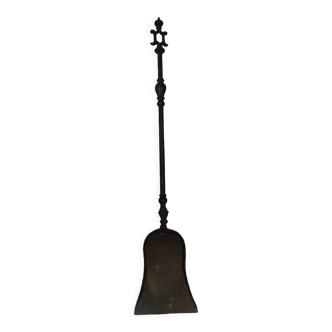 Cast iron carved fireplace shovel