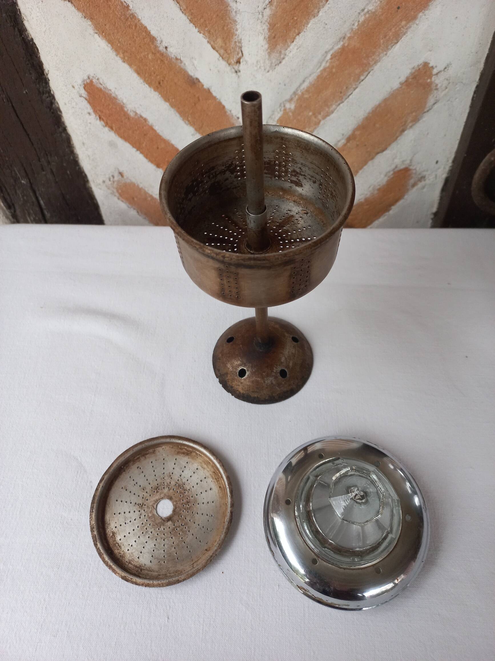 Silver metal coffee maker with glass cap