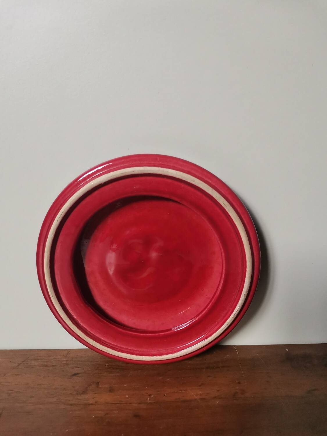 Vintage burgundy red slip ceramic coaster with duck pattern