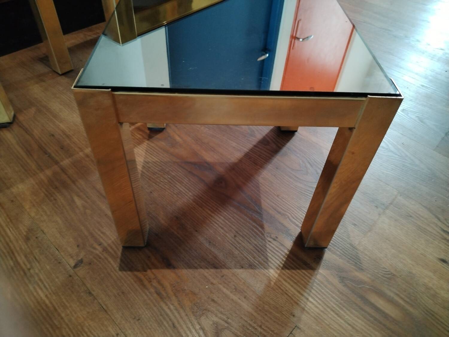 Vintage nesting table in gold metal and smoked mirror glass