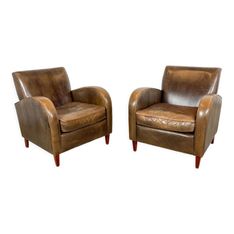 Set of two vintage leather wagon wheel armchairs Haarle
