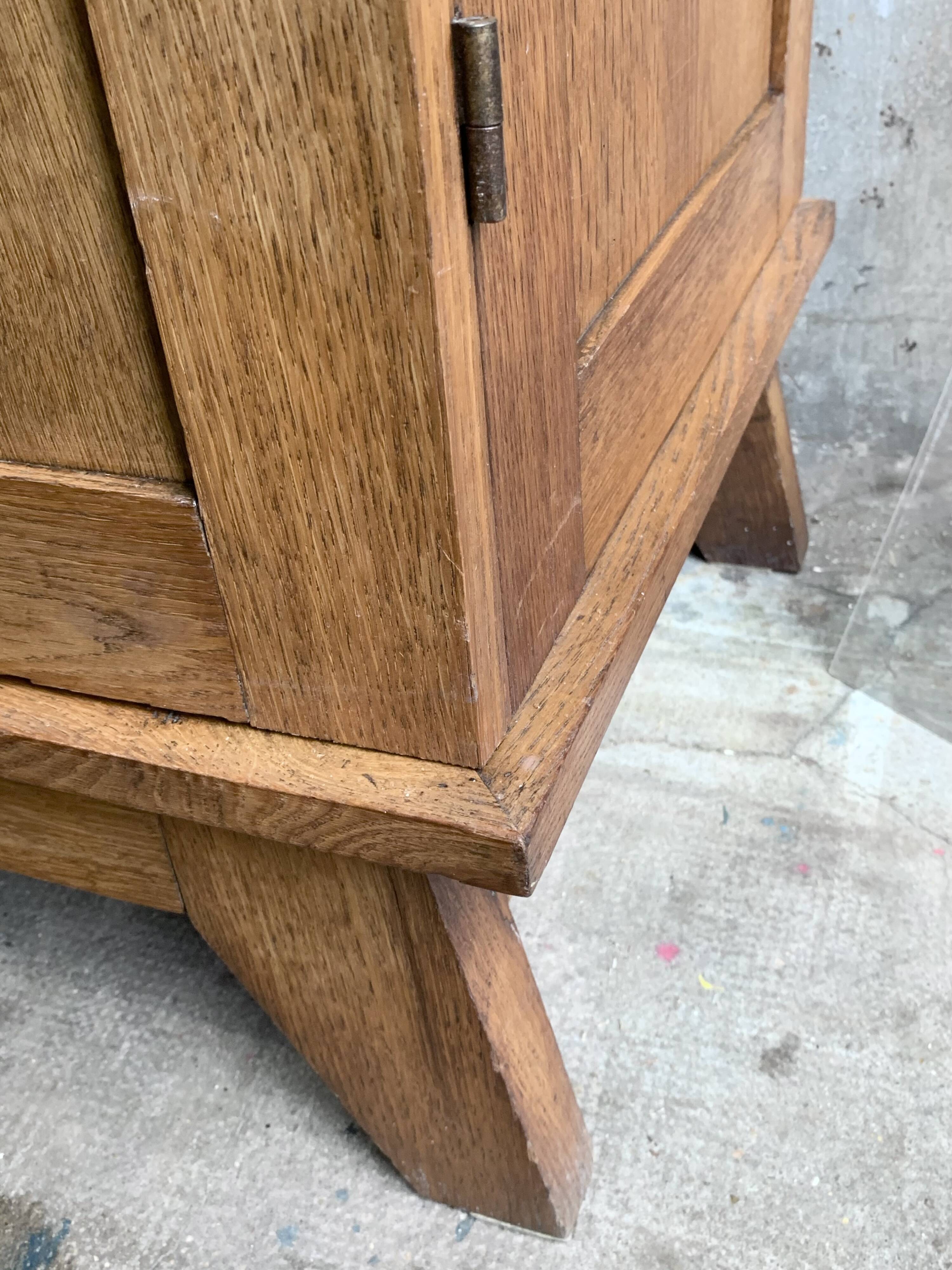 Solid oak compass foot cabinet René Gabriel 1945