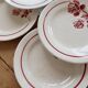 6 vintage dessert plates Moulin des Loups with burgundy floral decoration.