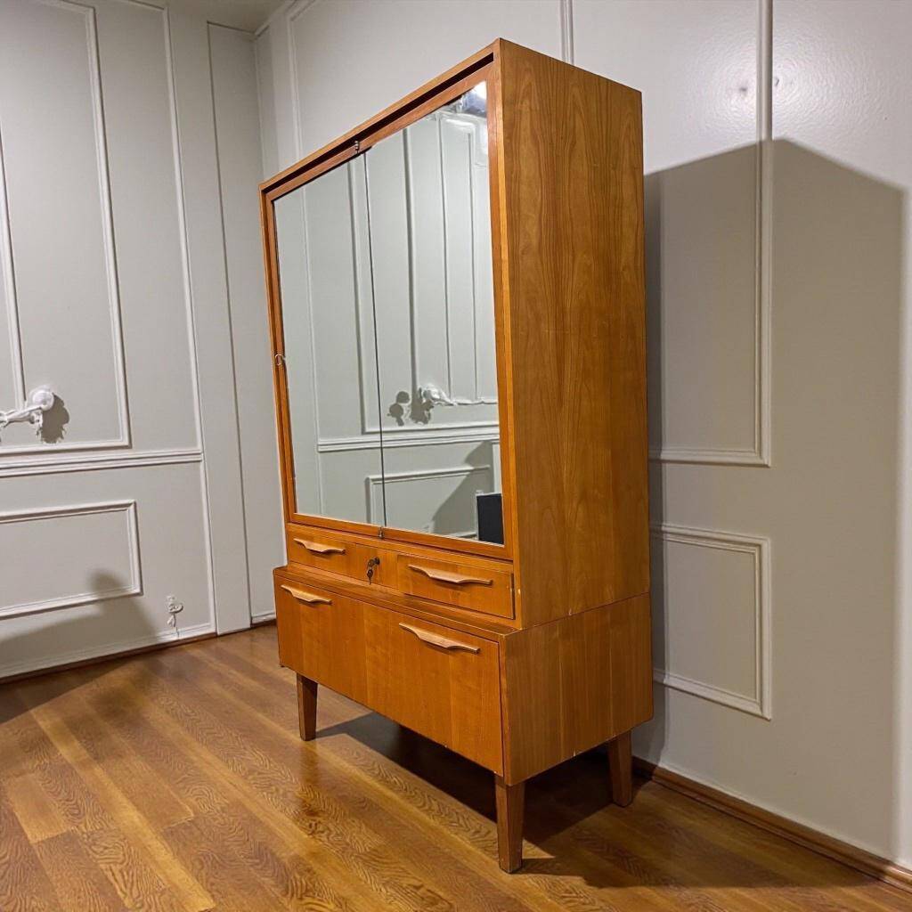 Vintage wooden wardrobe/shelf with mirror doors.