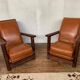 PAIR OF BRUTALIST ARMCHAIRS IN TEAK AND VINTAGE COGNAC LEATHER FROM THE 1950S
