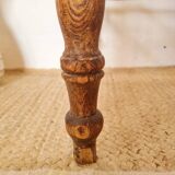 Wooden stool with cane seat