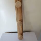 Old wall coat rack in raw wood