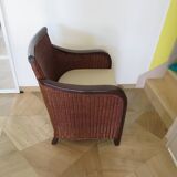 Vintage colonial-style armchair in woven rattan and exotic wood