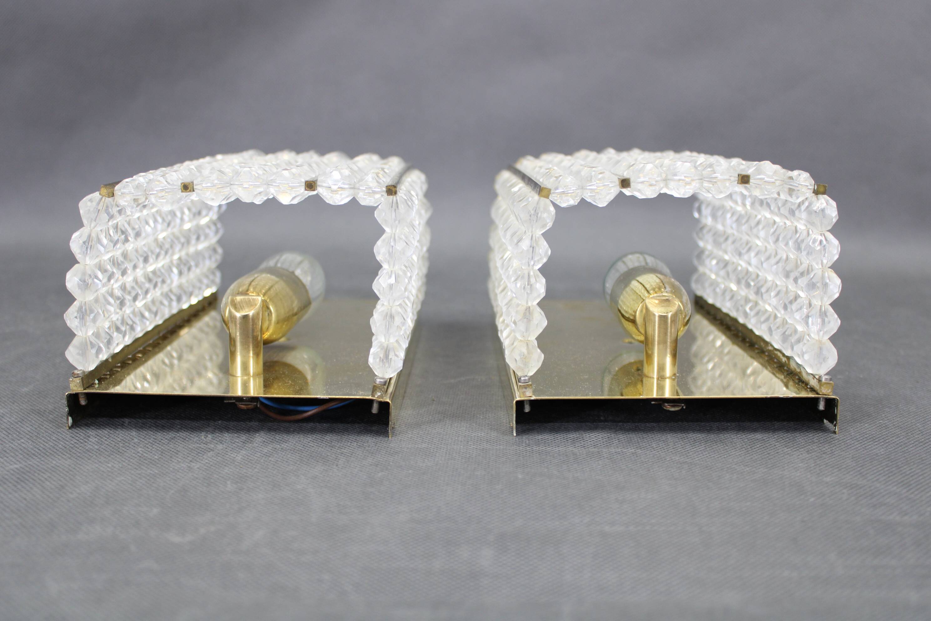Pair of Austrian mid-century brass and acrylic wall lights, 1970s