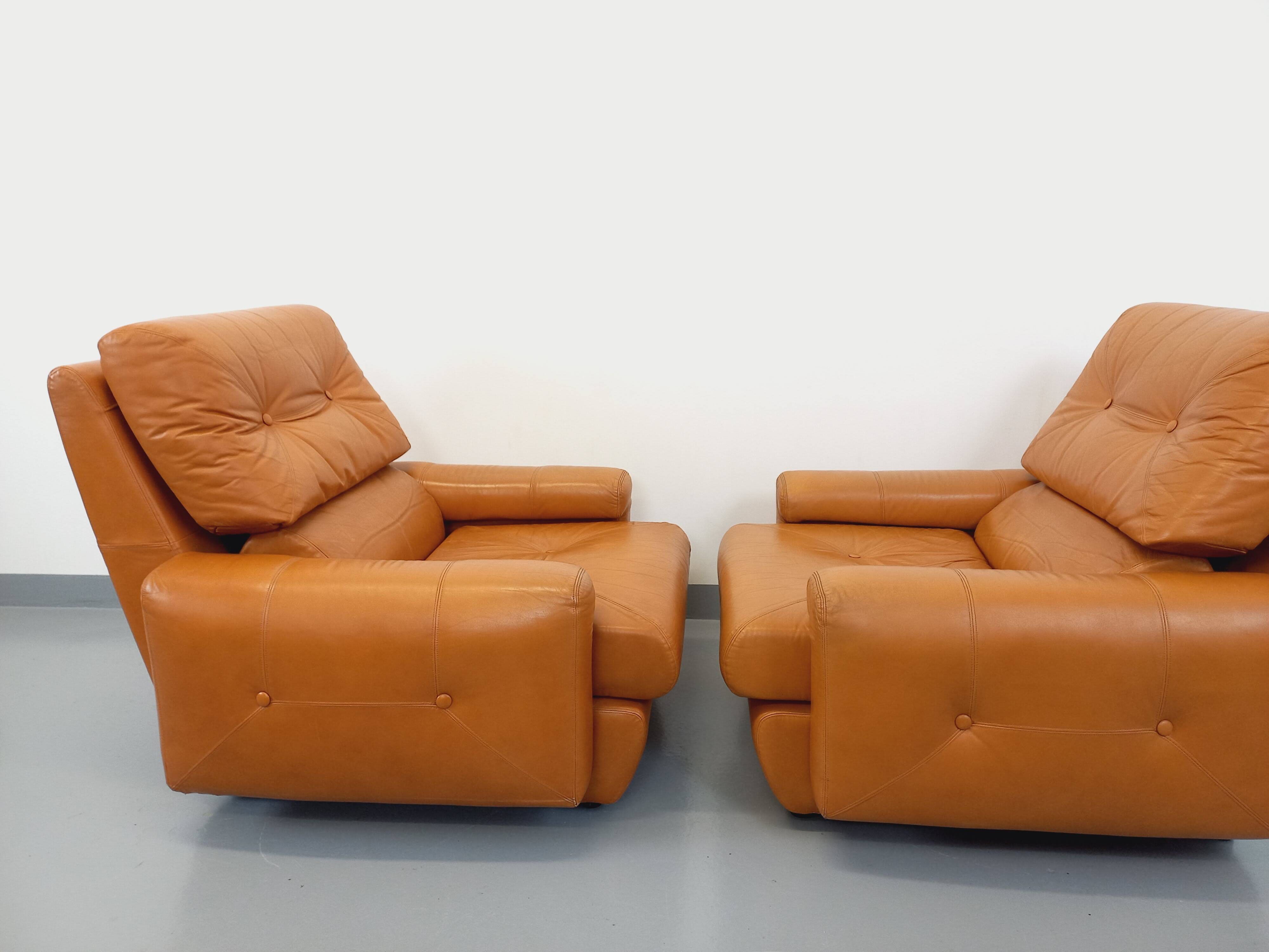 Pair of vintage leather lounge chairs from the 60s and 70s