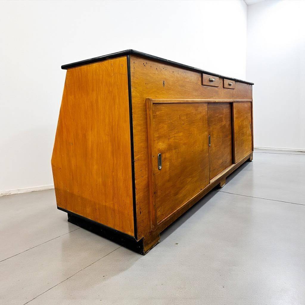 Vintage wooden shop counter with display case