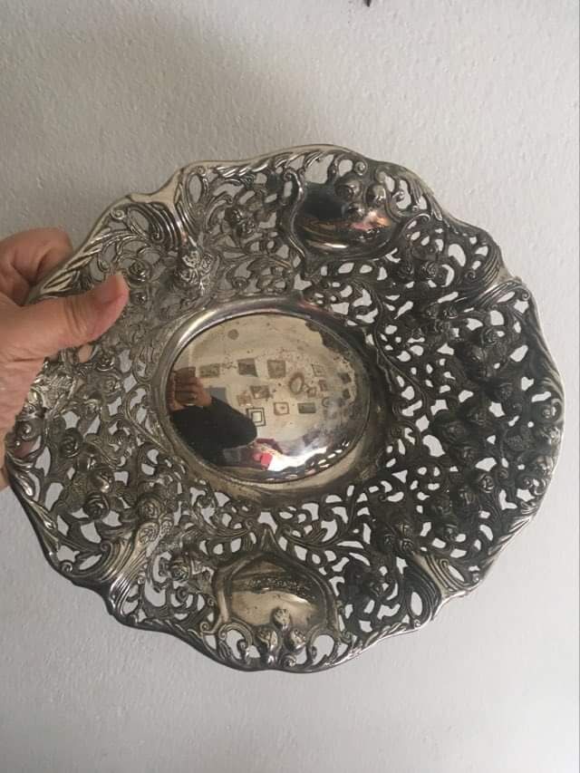 Silver metal basket with floral decoration