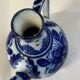Glazed ceramic carafe with floral decoration