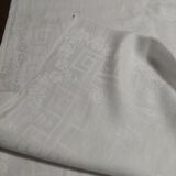 Table napkins set of eleven in a single piece damask linen and silk early 20th century.