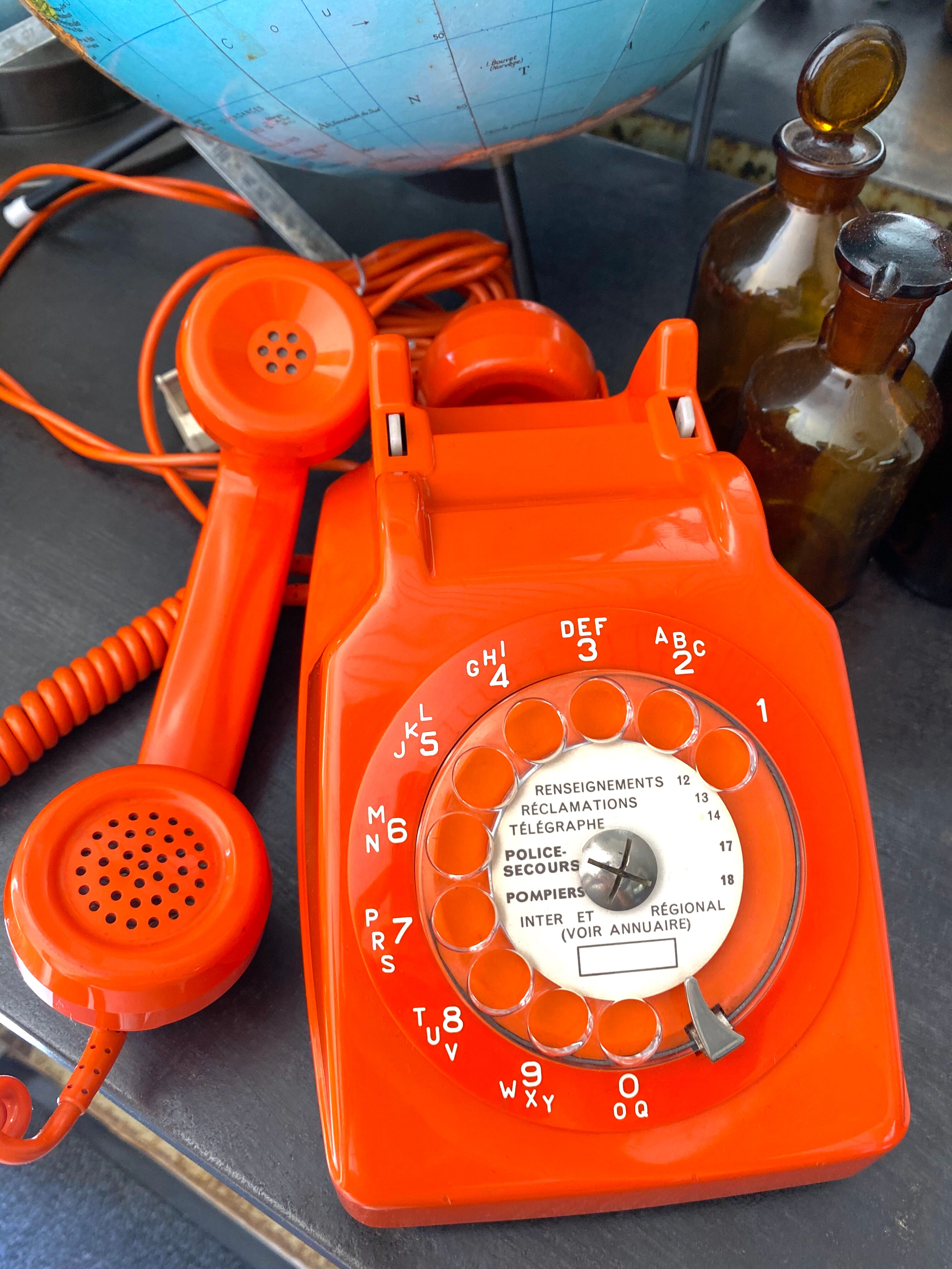 Orange vintage dial phone