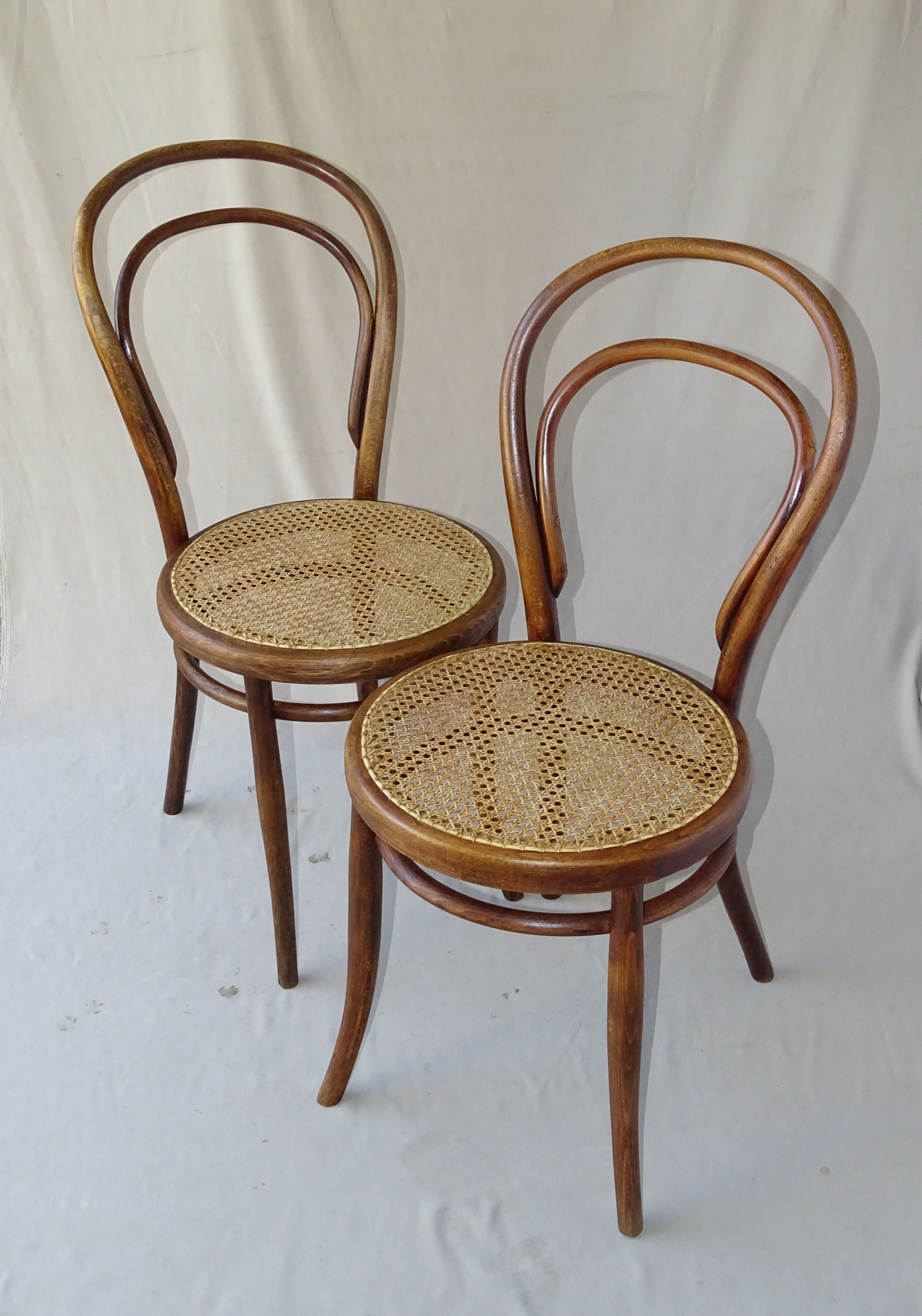 Two Turpe canned Bistro 1900 color rosewood chairs