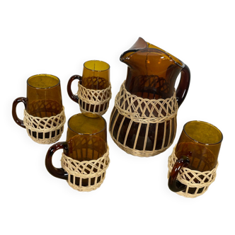 Carafe and glasses in amber glass and rattan