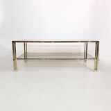 Table basse à deux niveaux en laiton Hollywood Regency Verre fumé en or des années 1970