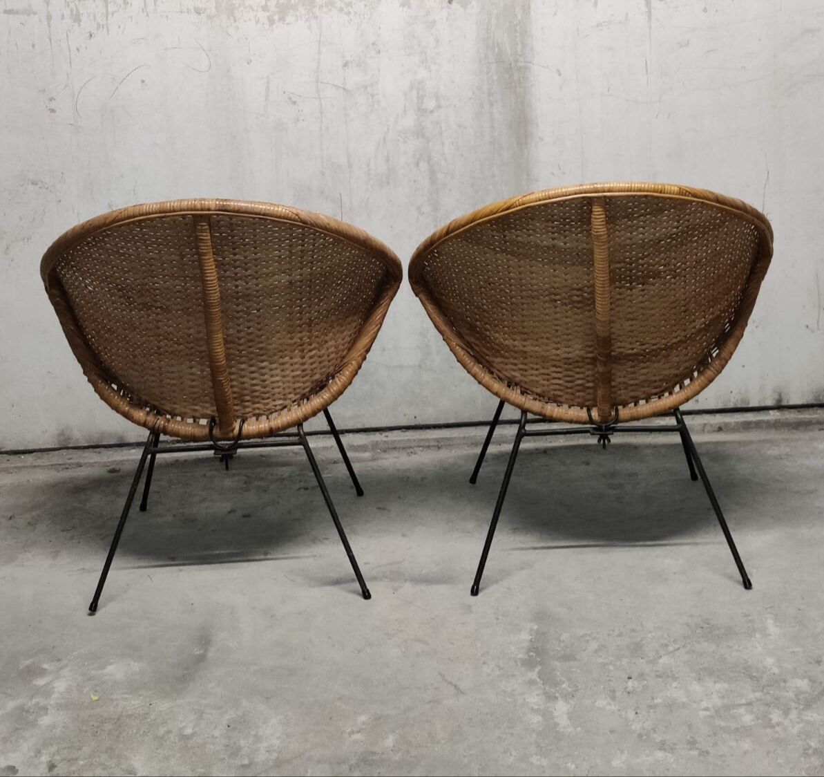 Pair of braided rattan armchairs