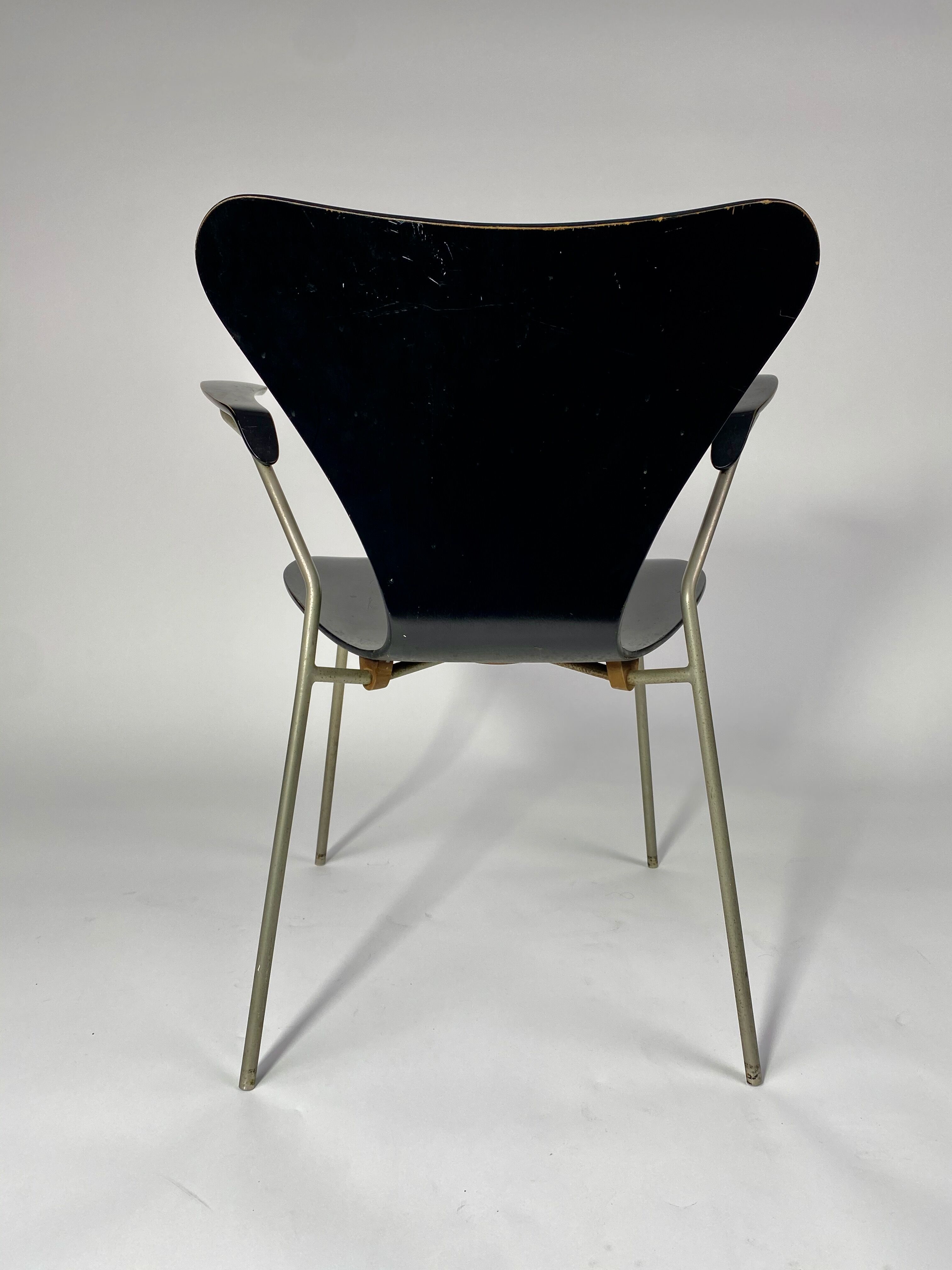 Arn Jocobsen black lacquered wooden armrest chair in the year 50