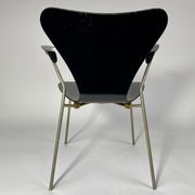 Arn Jocobsen black lacquered wooden armrest chair in the year 50