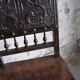 Pair of antique wooden and brown leather dining chairs, brass studs.