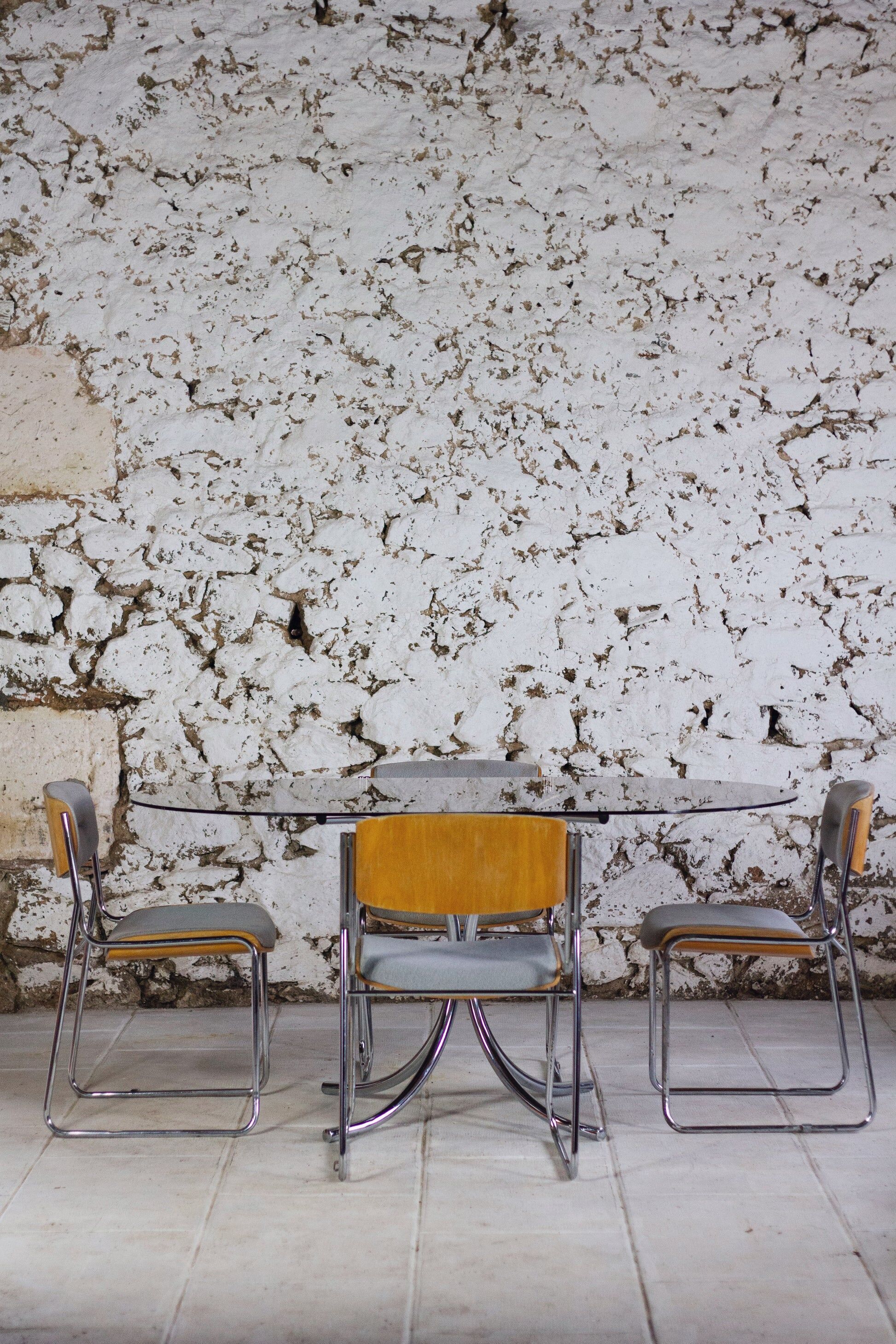 Oval dining table in chrome and smoked glass, 1970.