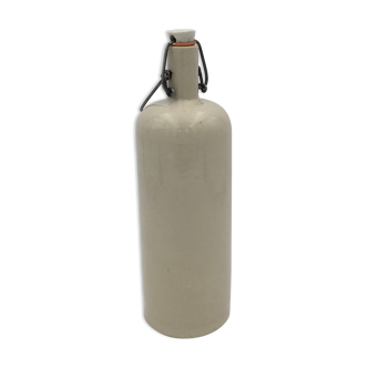Old beige enamelled sandstone bottle