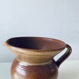 Old pitcher in glazed terracotta