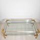 Coffee table with sliding shelf in lucite, brass and glass, Hollywood Regency