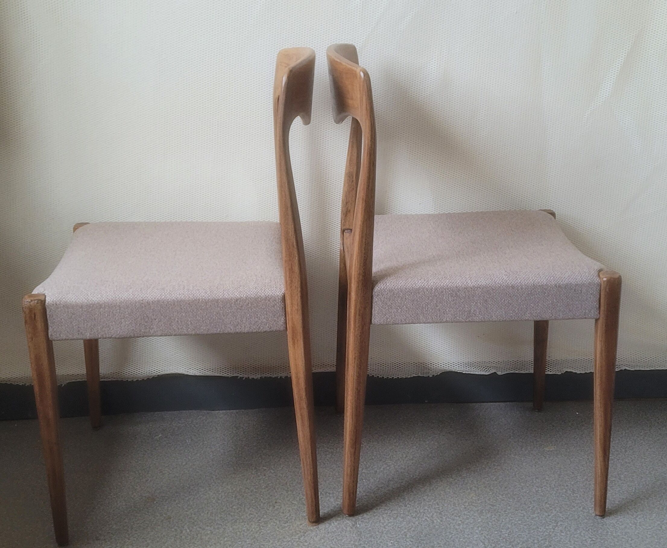 Pair of Scandinavian teak chairs sitting beige gray fabric