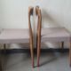 Pair of Scandinavian teak chairs sitting beige gray fabric