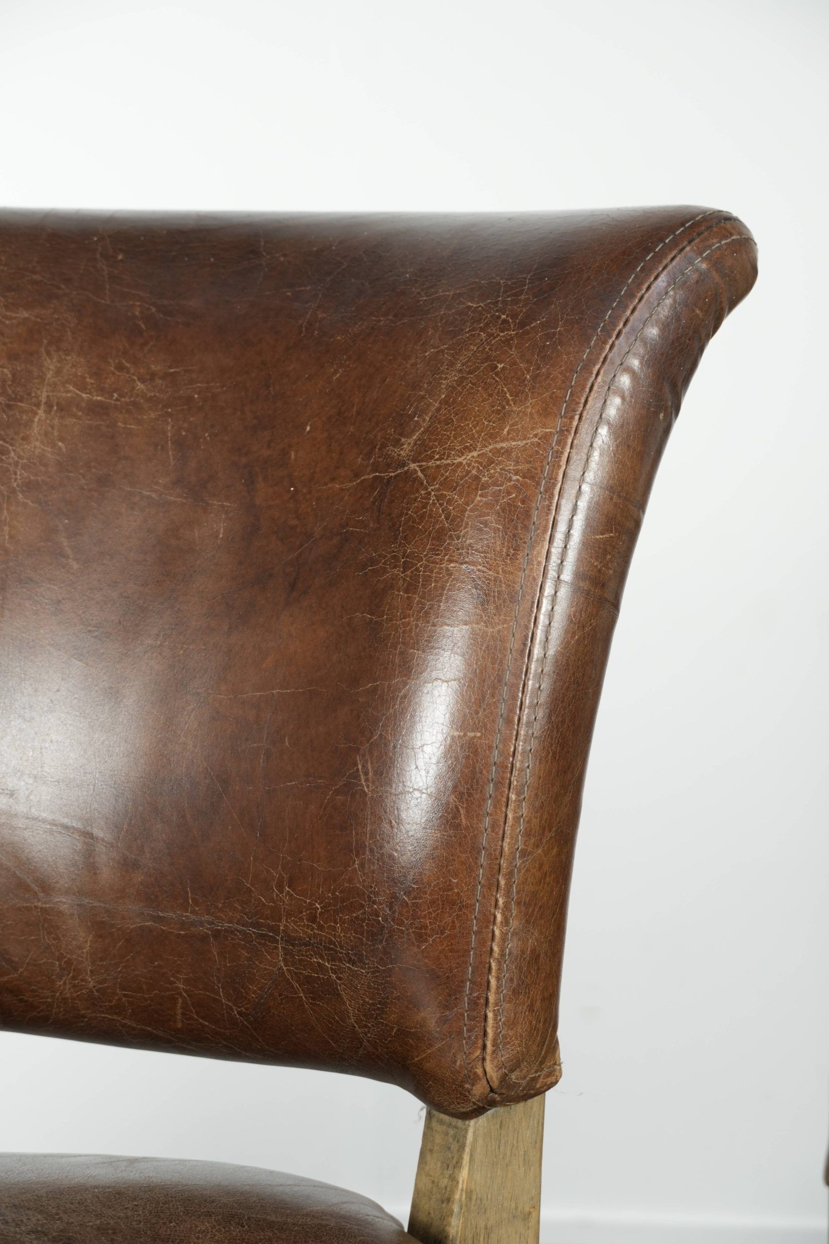 Set of 4 vintage cowhide and wooden dining chairs