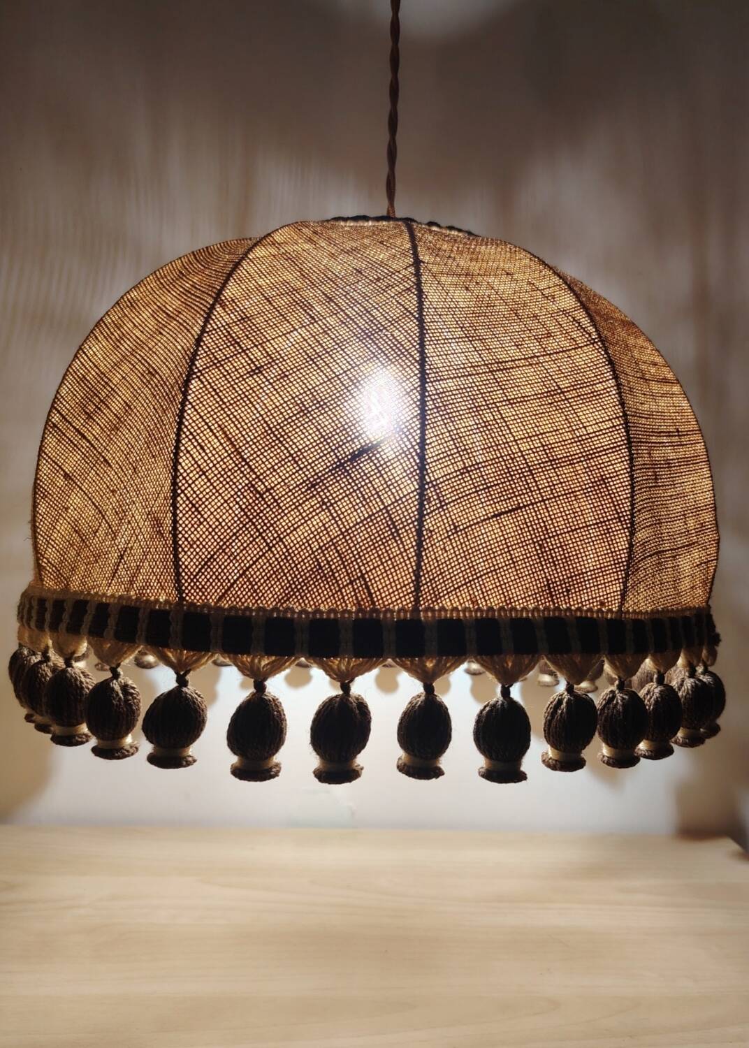 Large hanging pendant light with a burlap and pom-pom style