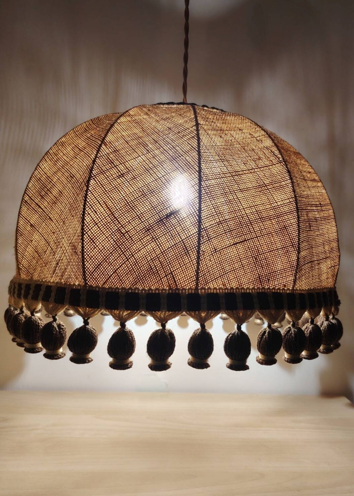 Large hanging pendant light with a burlap and pom-pom style