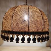 Large hanging pendant light with a burlap and pom-pom style