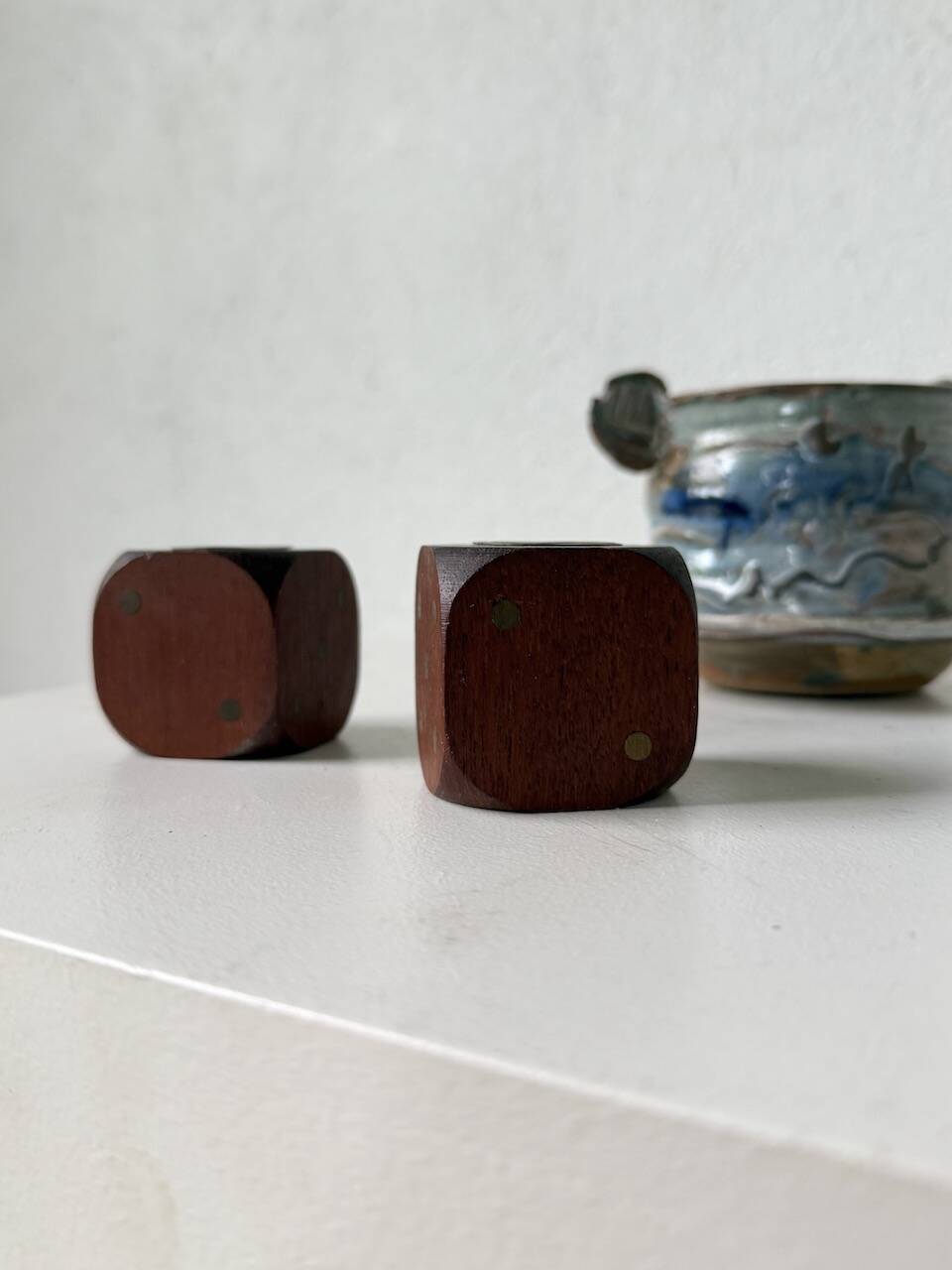 Pair of 1960s teak and brass "dice" candlesticks