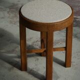 Mid-century Danish stool in oak, reupholstered in boucle wool, circa 1950.